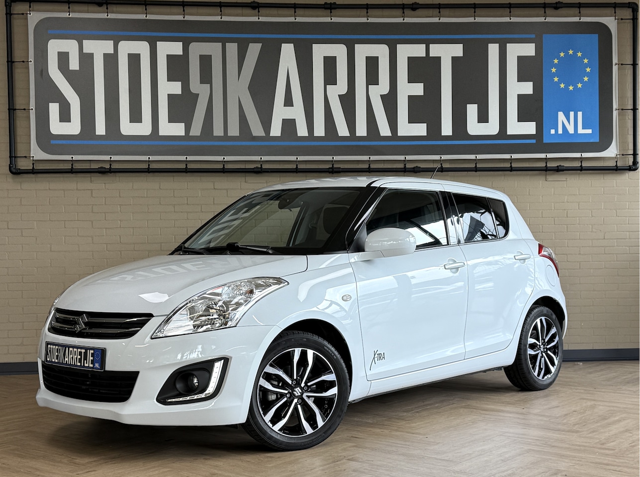 Suzuki Swift - 1.2 94pk X-tra 2016 | Airco | Stoelverwarming | 16"velgen | Cruise Control | Dealer onderh - AutoWereld.nl