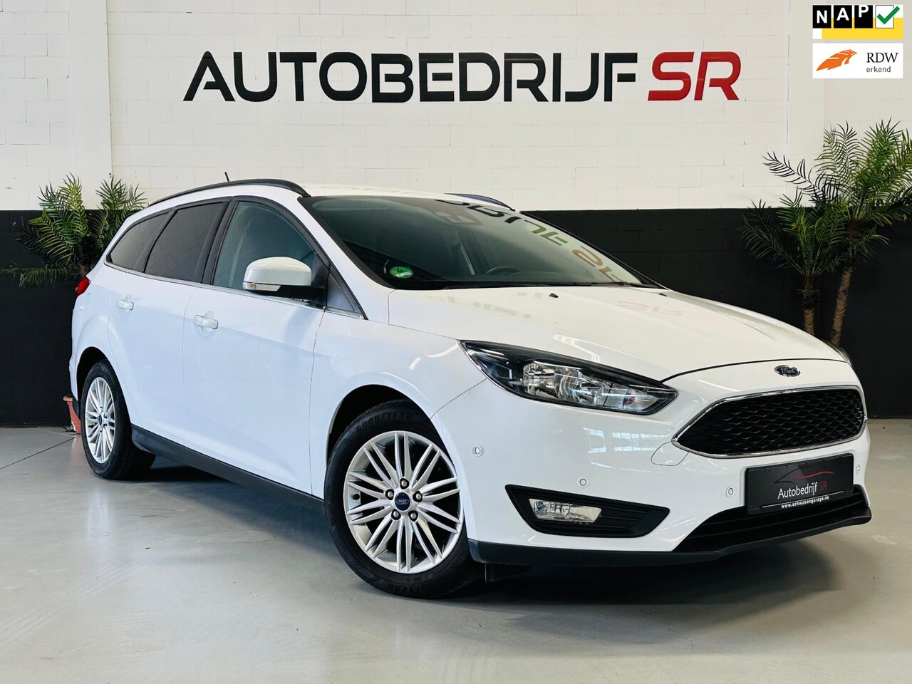 Ford Focus Wagon - 1.0 EcoBoost Titanium Navigatie! PDC voor en achter! Stoelverw! Stuurverwarming - AutoWereld.nl