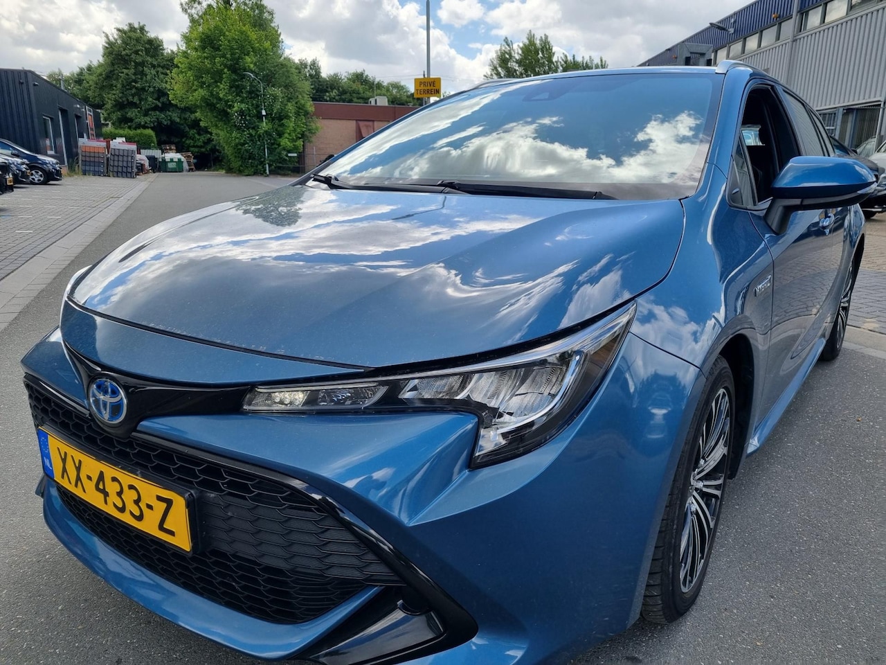 Toyota Corolla Touring Sports - 1.8 Hybrid Active Camera - AutoWereld.nl