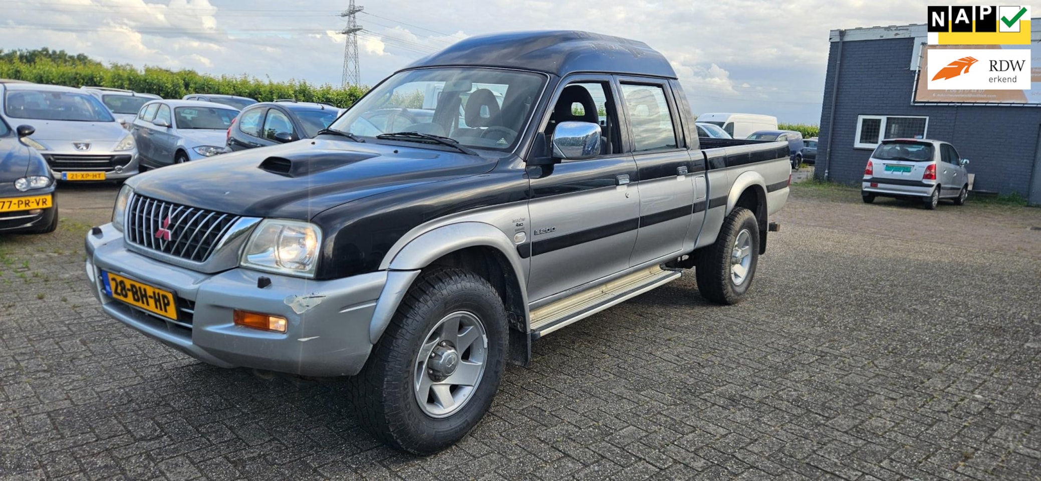 Mitsubishi L 200 - 2.5 TDi Double Cab Airco 5 seats Pick up 4x4 - AutoWereld.nl