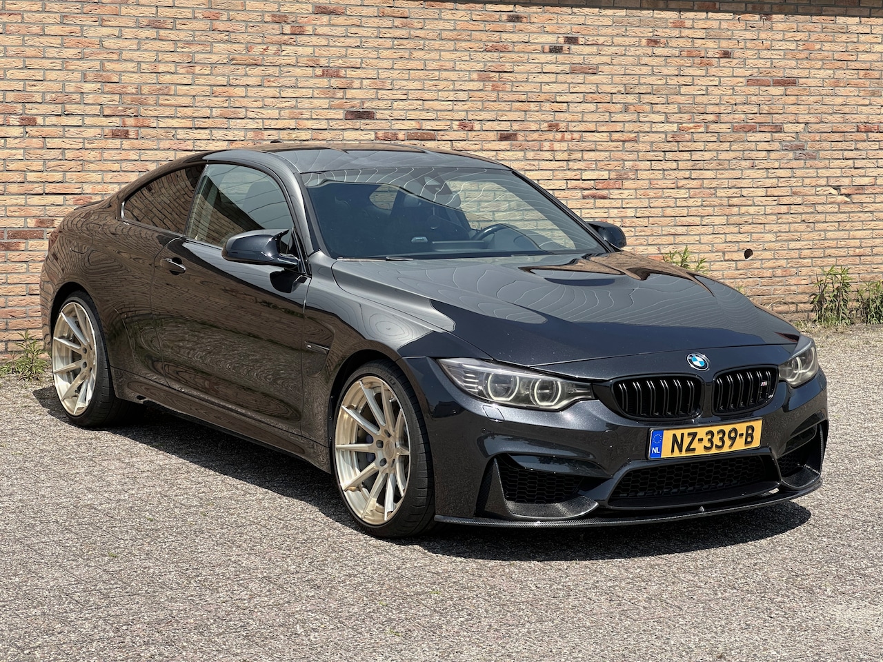 BMW 4-serie Coupé - M4 Competition Carbon pack M performance pack en uitlaat - AutoWereld.nl