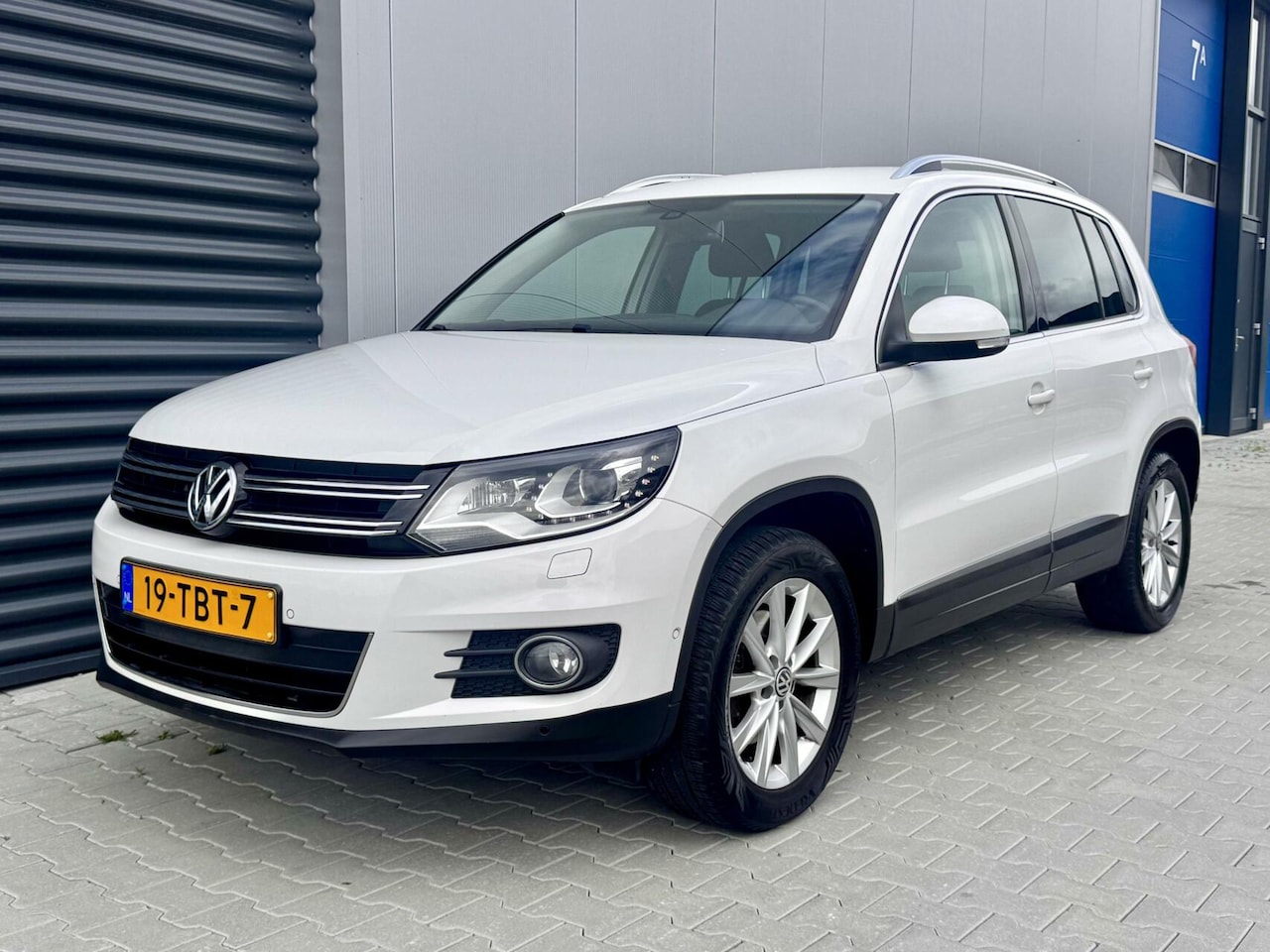 Volkswagen Tiguan - 1.4 TSI Sport&Style | Xenon | Navi | Clima - AutoWereld.nl