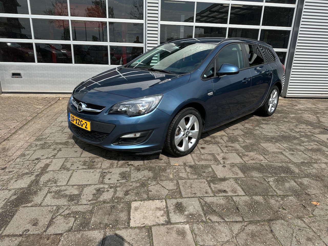 Opel Astra Sports Tourer - 1.4 Turbo Cosmo - Cruise Control - Parkeersensoren - Airco - Navigatie - AutoWereld.nl
