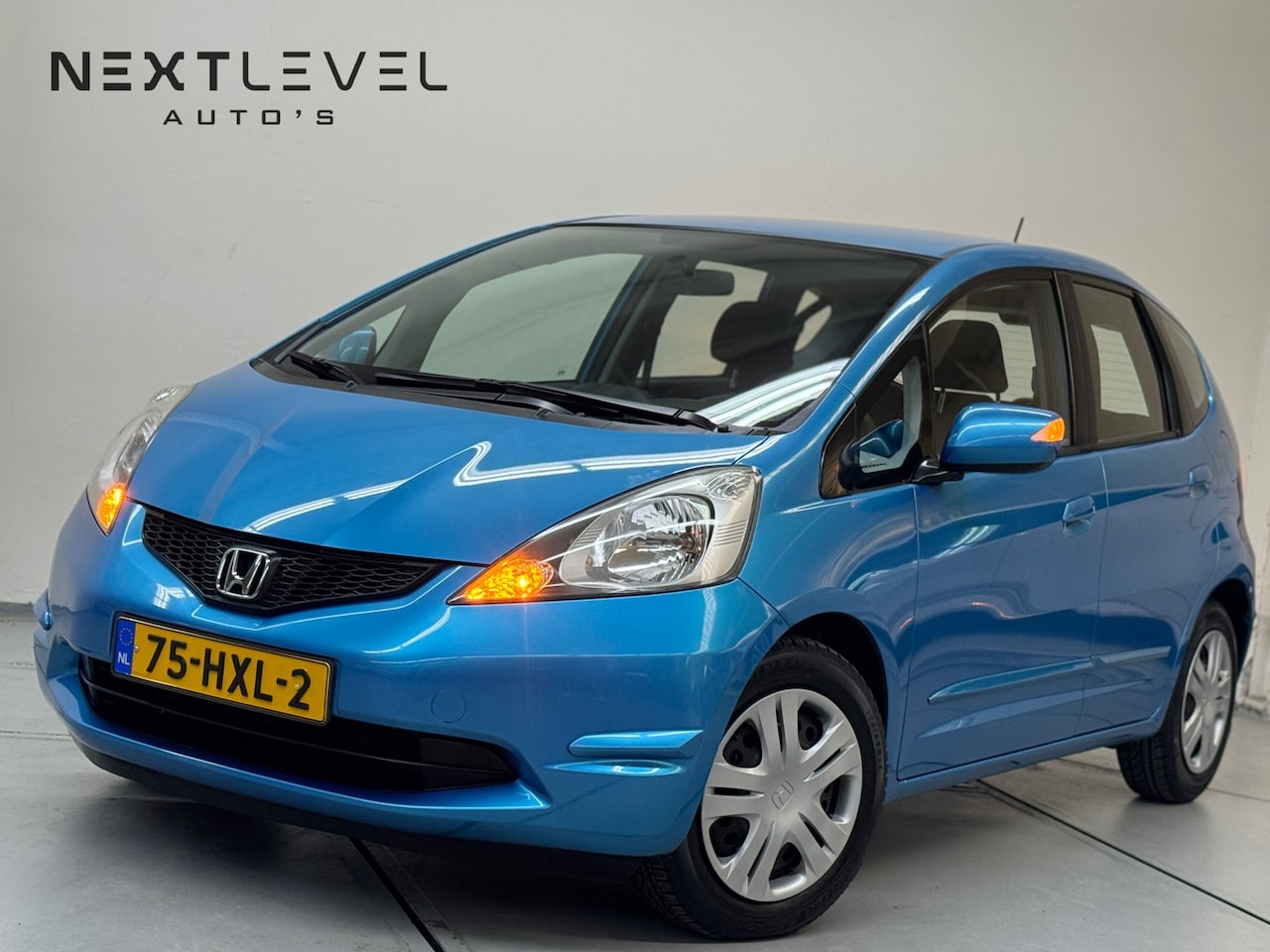 Honda Jazz - 1.4 Comfort LAGE KM Automaat Zeer Nette - AutoWereld.nl