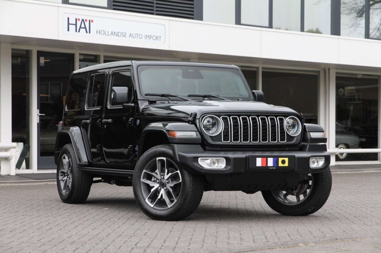 Jeep Wrangler Unlimited - 4xe 380 Sahara I Sky One I 4 JAAR GARANTIE I NW. MODEL - AutoWereld.nl