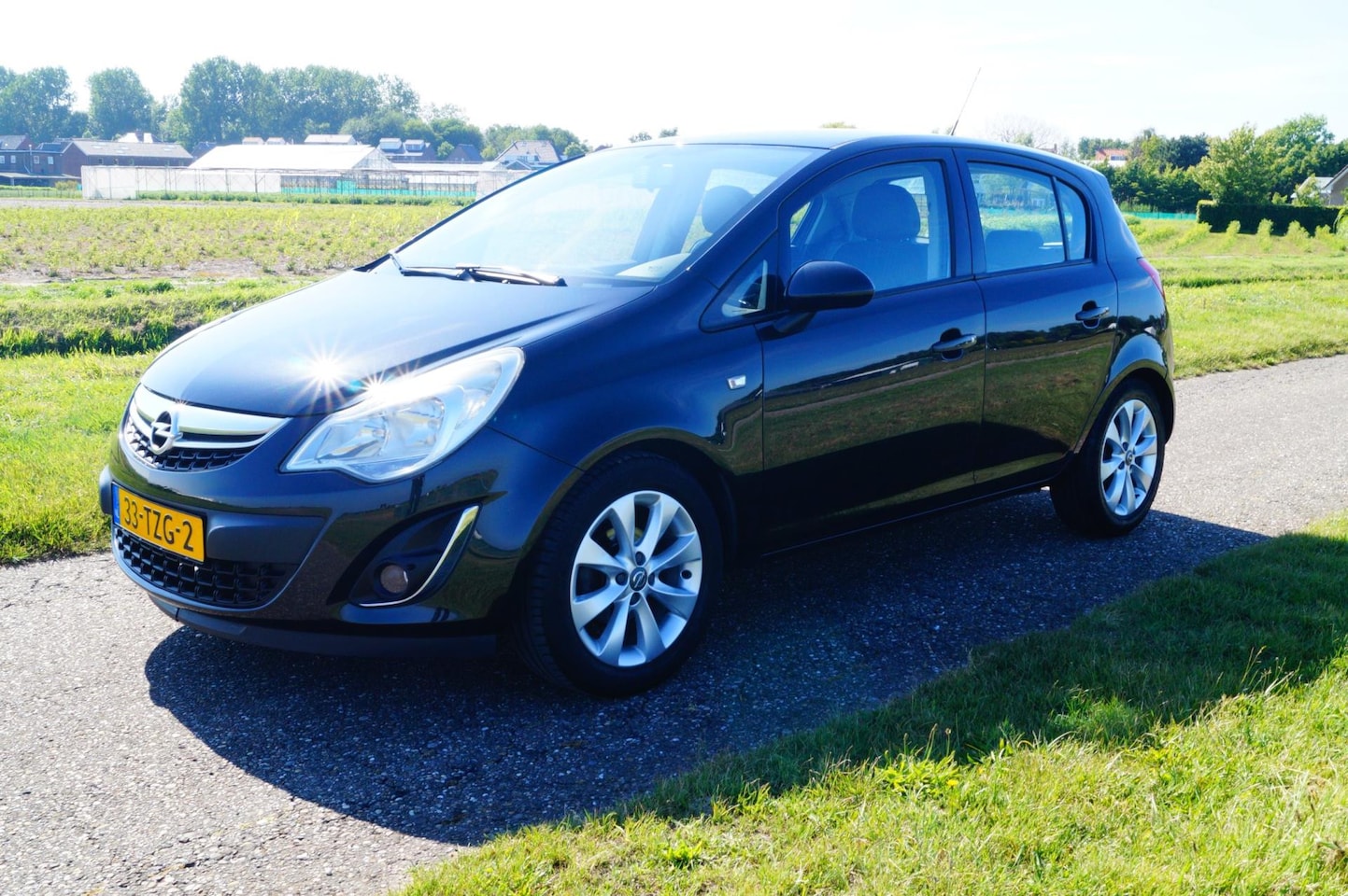 Opel Corsa - 1.2-16V Anniversary Edition Airco Cruise Control - AutoWereld.nl