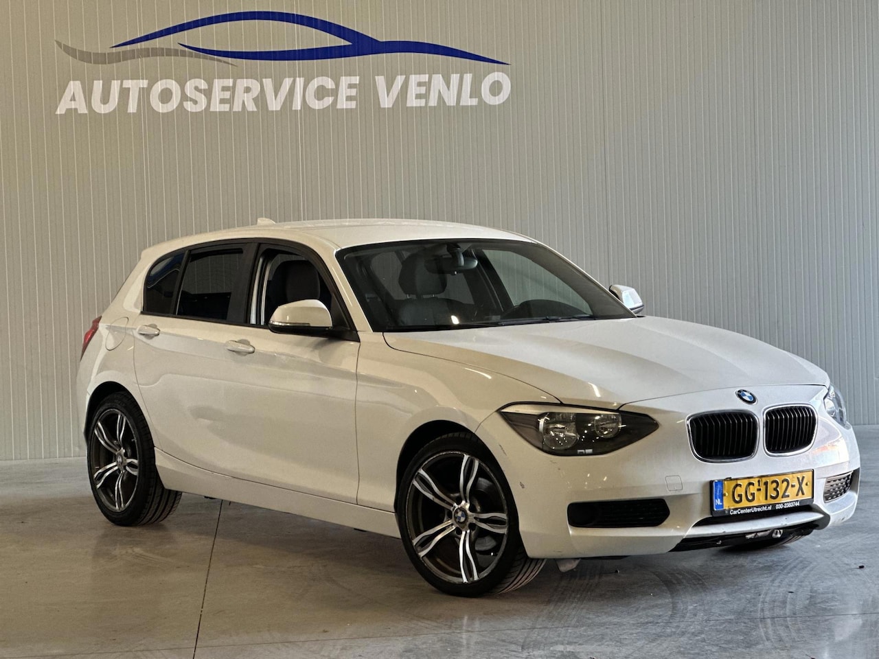 BMW 1-serie - BMW 116i High Executive Wit | lichte schade | lees advertentie - AutoWereld.nl