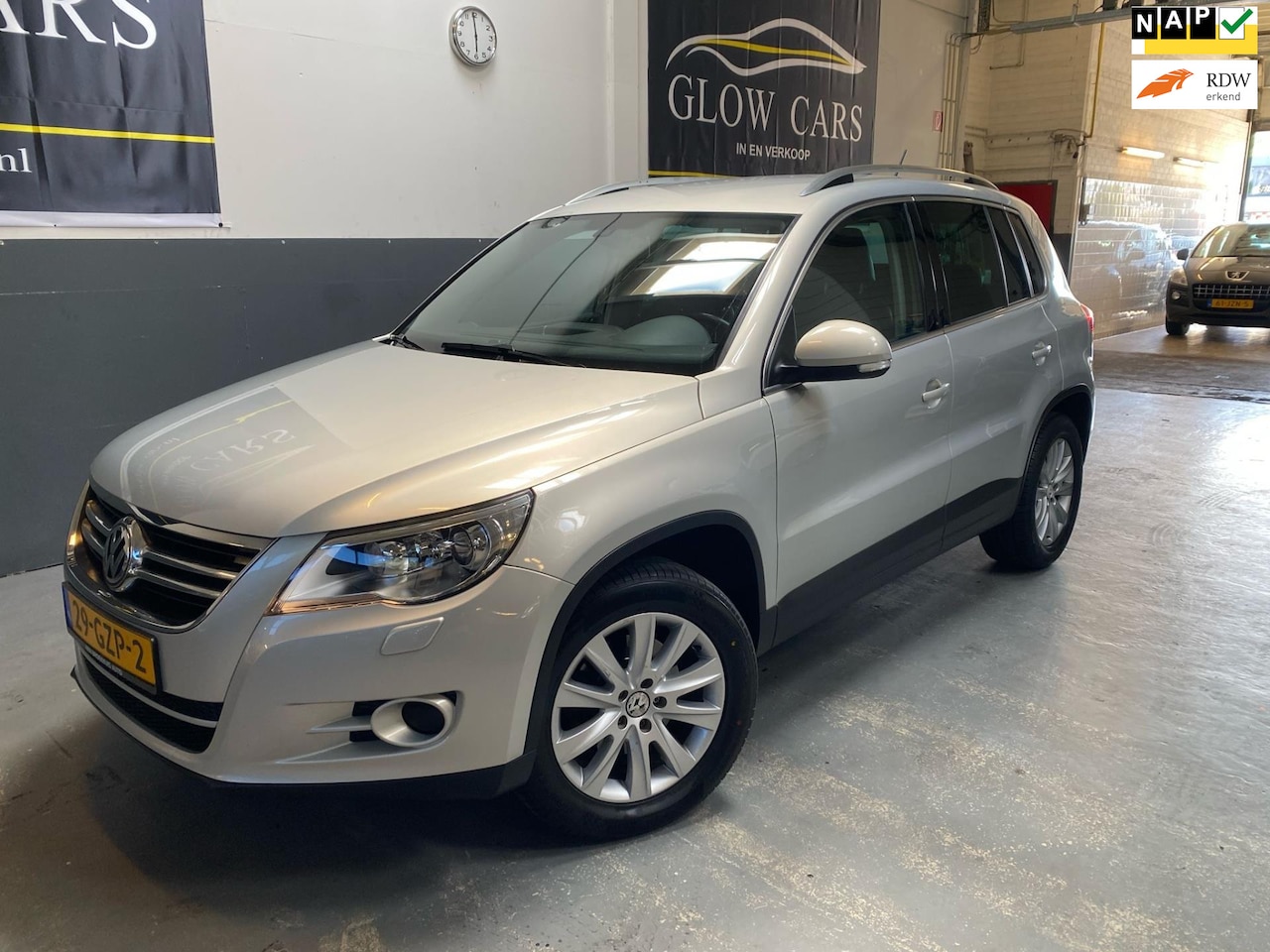 Volkswagen Tiguan - 2.0 TSI Sport&Style 4Motion AUTOMAAT | CRUISE | PDC | NAVI | LEDER - AutoWereld.nl