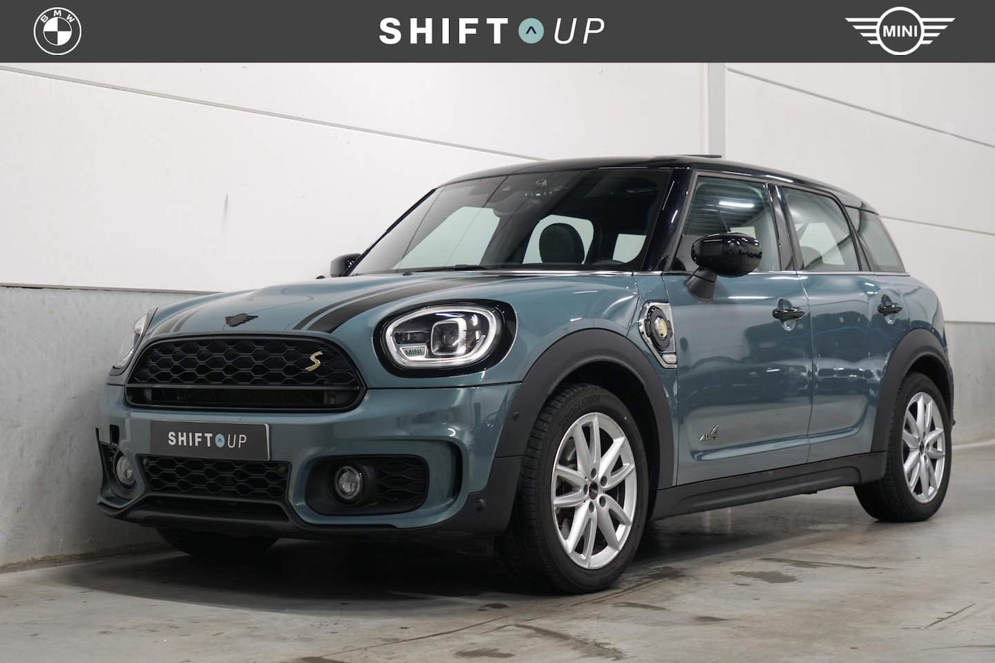MINI Countryman - Mini 2.0 Cooper S E ALL4 Panoramadak | JCW | Head Up | Camera - AutoWereld.nl