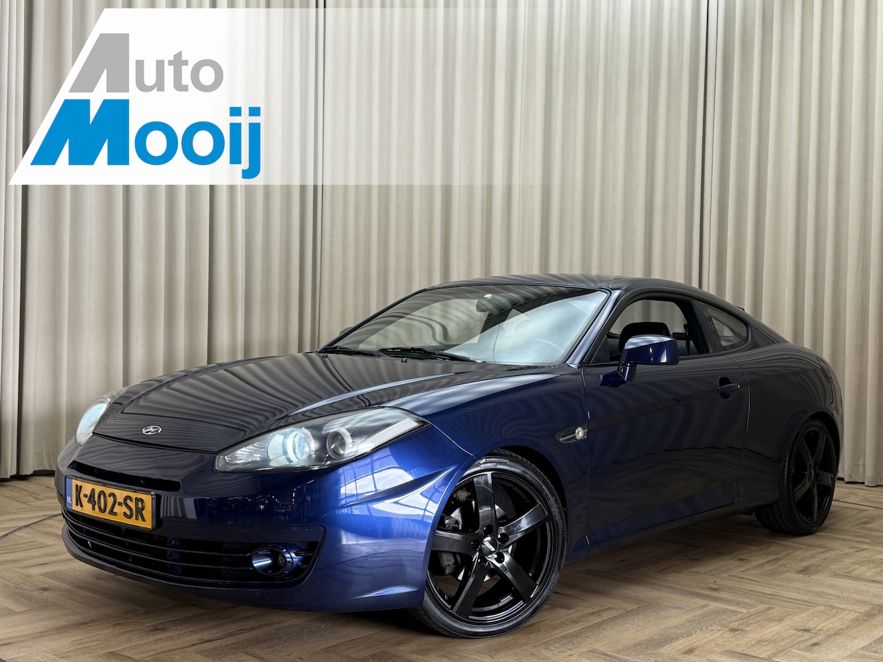 Hyundai Coupé - *Leder* Airconditioning / 18'' LMV / Afn. Trekhaak / Elek. Pakket - AutoWereld.nl