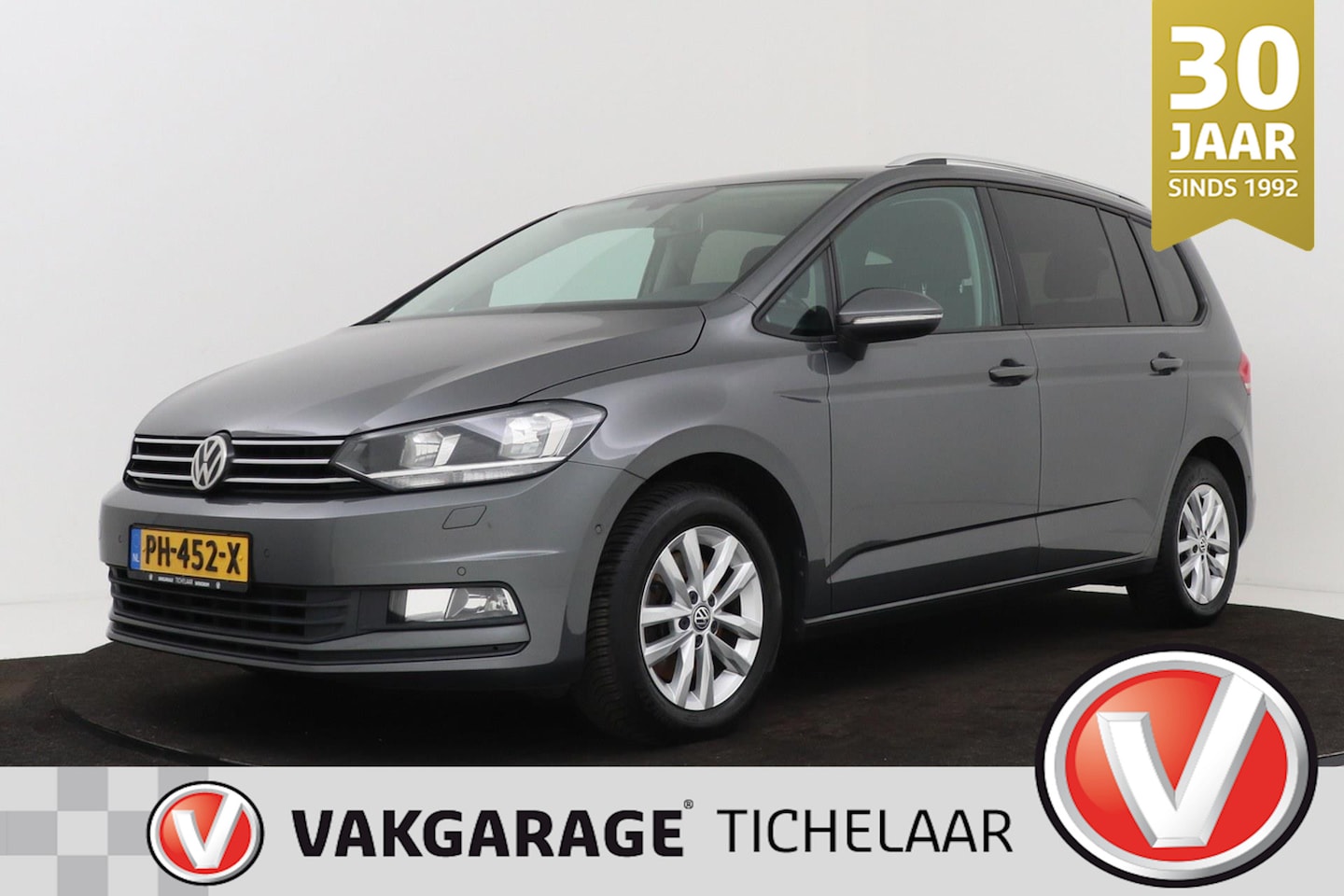 Volkswagen Touran - 1.2 TSI Business 7p | Trekhaak | CarPlay | Navigatie | Stoelverwarming | - AutoWereld.nl