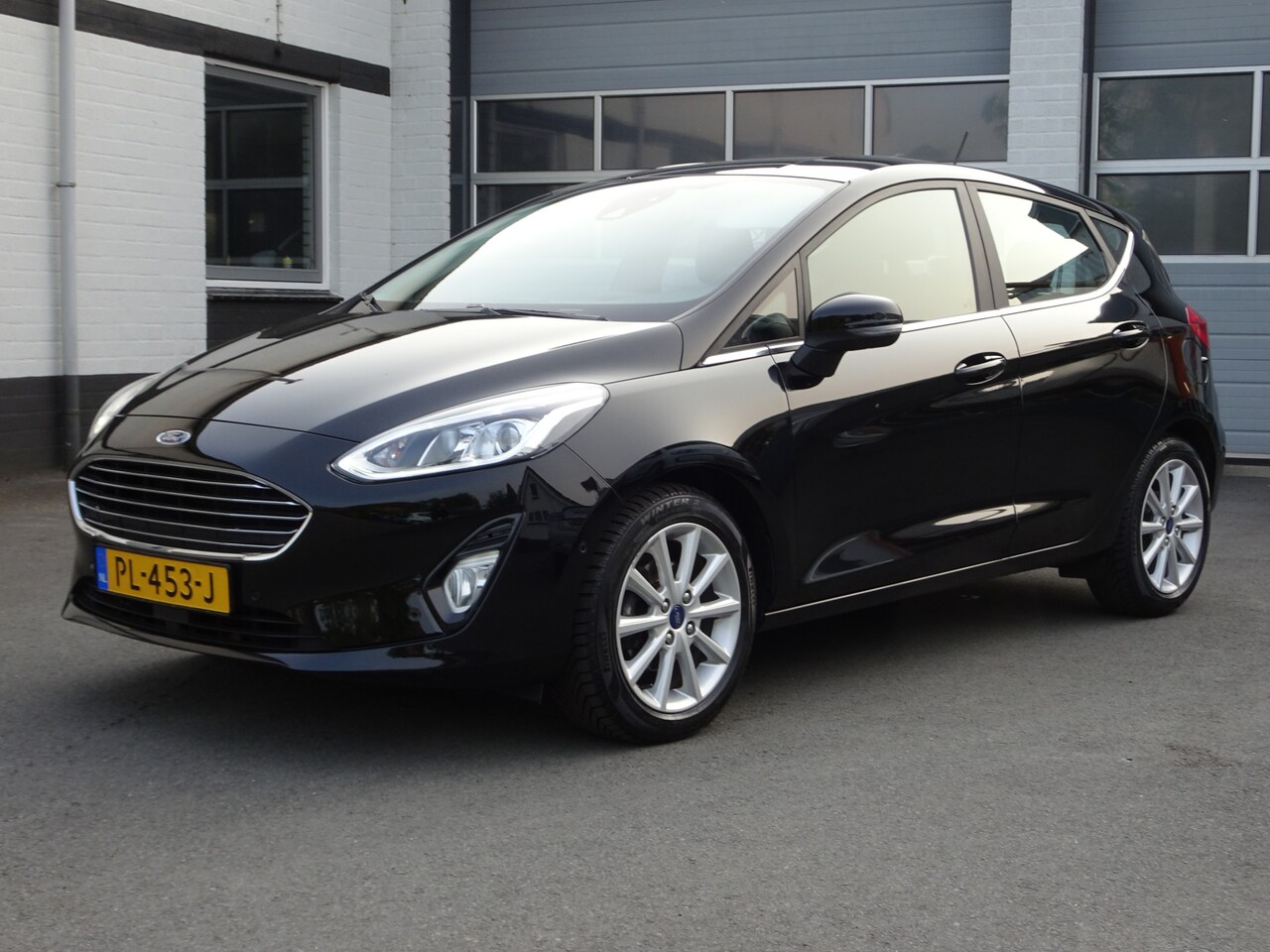 Ford Fiesta - 1.0 EcoBoost Titanium Automatische airco, naviagtie, parkeersensoren voor en achter, cruis - AutoWereld.nl