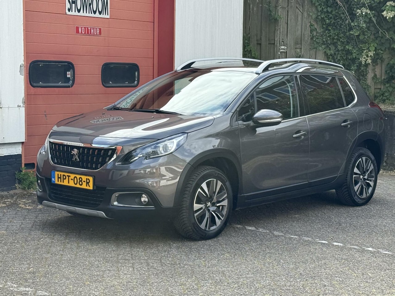 Peugeot 2008 - 1.2 PureTech Allure Sport trekhaak camera pano - AutoWereld.nl
