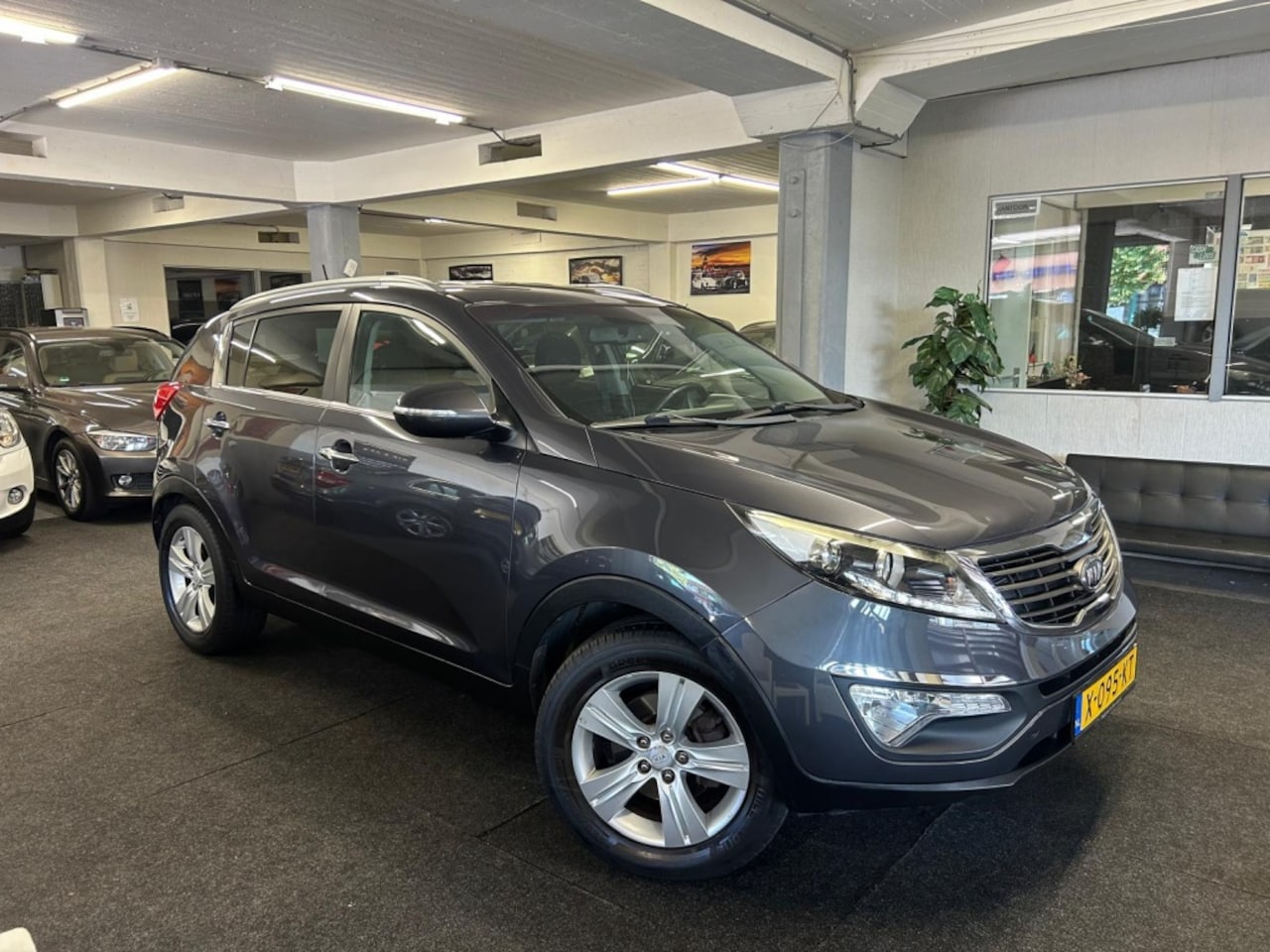 Kia Sportage - 1.6 GDI X-tra*Navi*Clima*Led*2012 - AutoWereld.nl