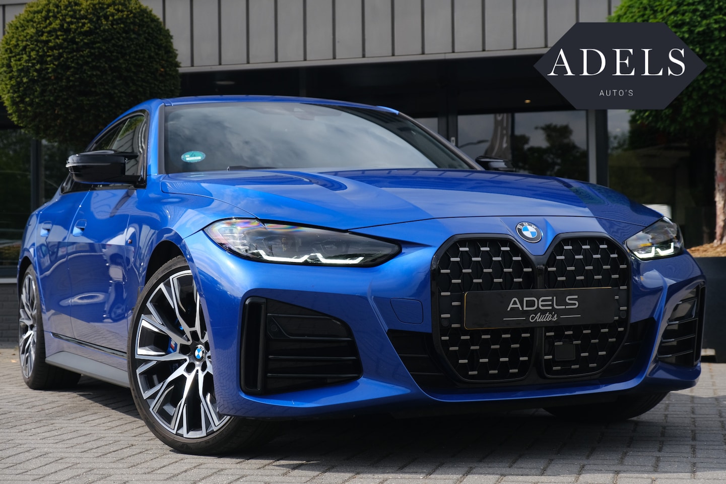 BMW 4-serie Gran Coupé - M440i xDrive High Executive Portimao Blauw Carbon Harman Kardon - AutoWereld.nl