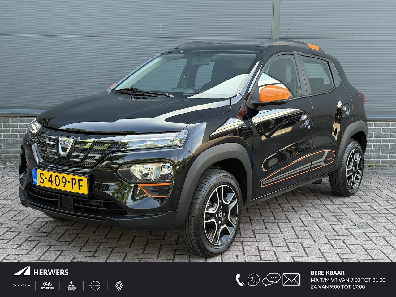 Dacia Spring - Comfort Plus (Orange Pack) 27 kWh / Lederen Bekleding / Navigatie / Achteruitrij Camera / - AutoWereld.nl