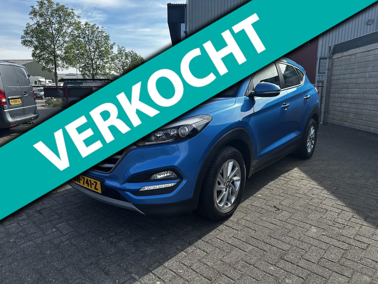 Hyundai Tucson - 1.7 CRDi HP Comfort Automaat | Trekhaak | Navigatie | Camera | Cruise Control - AutoWereld.nl