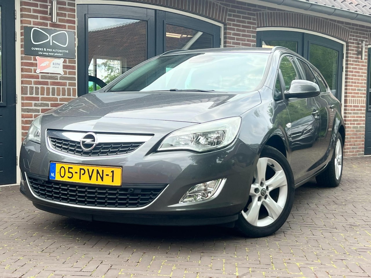 Opel Astra Sports Tourer - 1.4 Turbo Edition | NAP | NAVI | CRUISE | GEREVISEERDE BAK | TREKHAAK - AutoWereld.nl