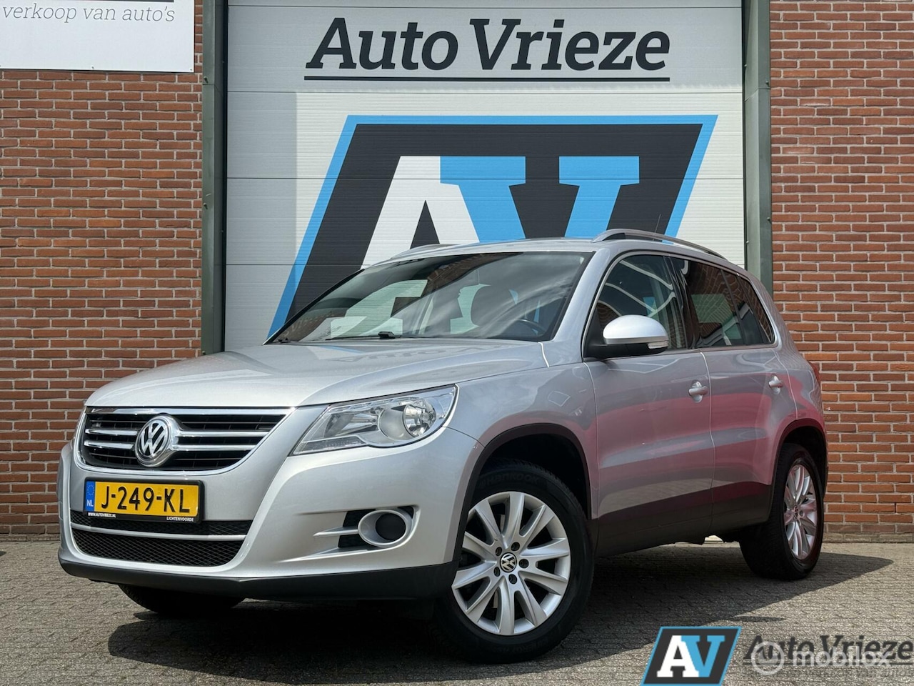 Volkswagen Tiguan - 1.4 TSI Sport&Style, Trekhaak, PDC, Navi - AutoWereld.nl