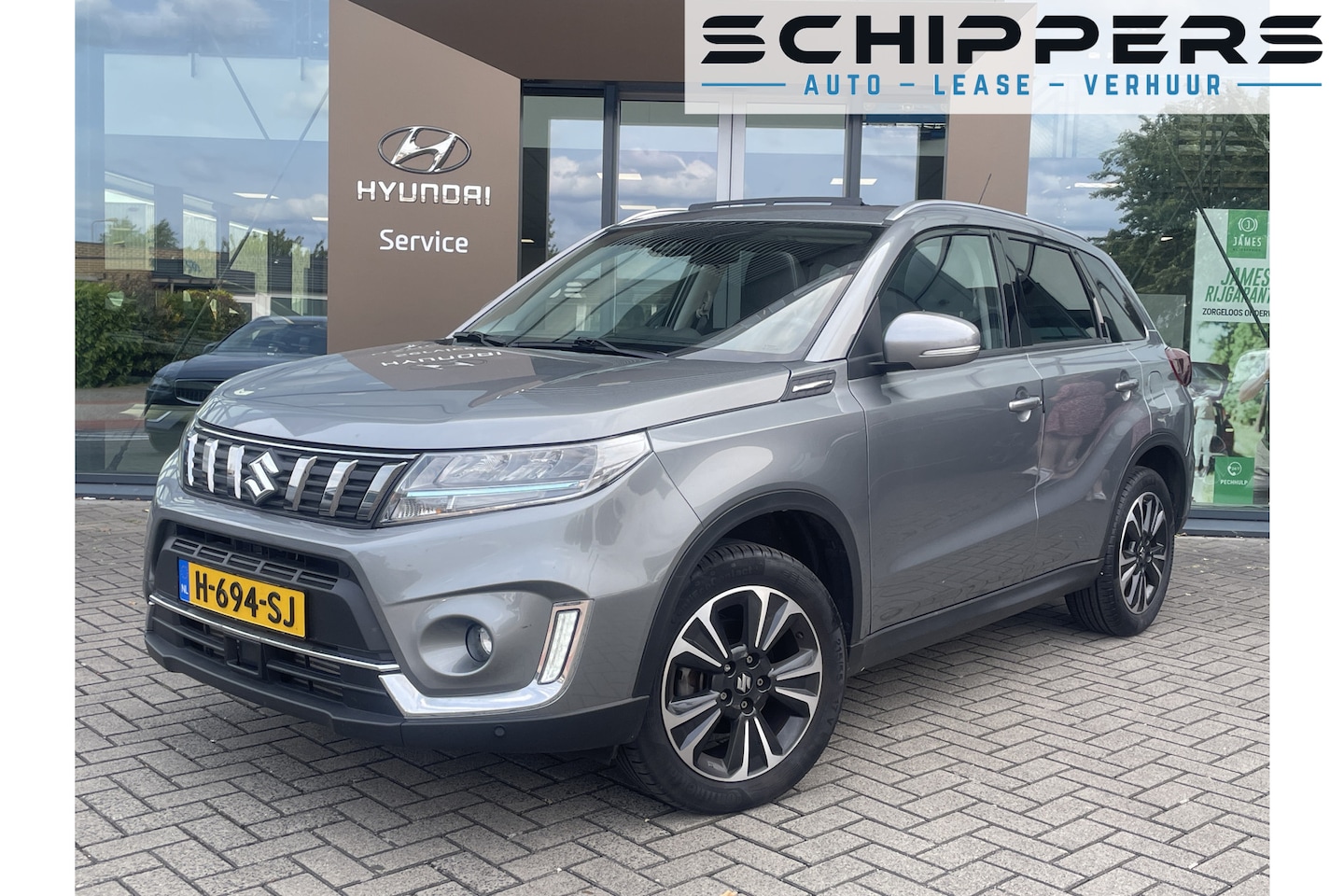 Suzuki Vitara - 1.4 Boosterjet Style Smart Hybrid Navigatie | Panoramadak | Trekhaak - AutoWereld.nl