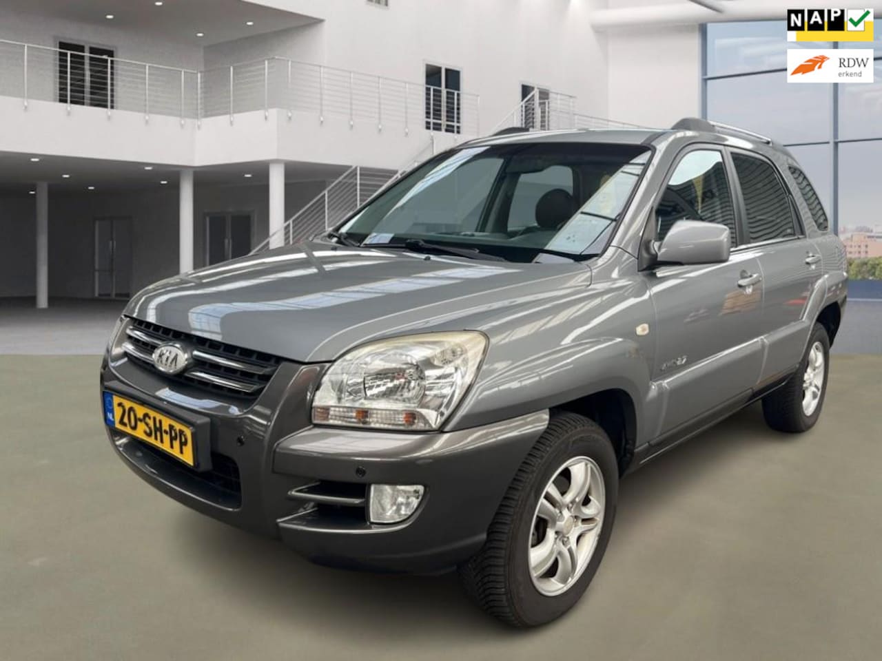 Kia Sportage - 2.7 V6 Adventure 4WD|AUT|CAMERA|NAVI|STOELVERW|PSENSOR|HALFLEDER - AutoWereld.nl