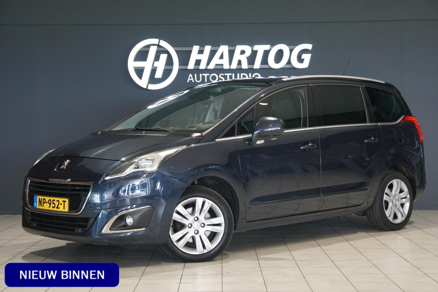 Peugeot 5008 - 1.6 BlueHDi Style 7p. + PANORAMA /  HEAD-UP / TREKHAAK - AutoWereld.nl
