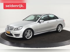 Mercedes-Benz C-klasse - 180 AMG Sport | Stoelverwarming | Xenon | Half leder | Navigatie | Climate control | Park