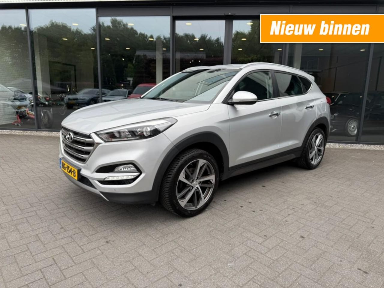 Hyundai Tucson - 1.6 GDI Comfort 1.6 GDI Comfort,Lane Ass.,Trekhk Afn.,Navi,Clima,Stoelverw 4x,Camera - AutoWereld.nl