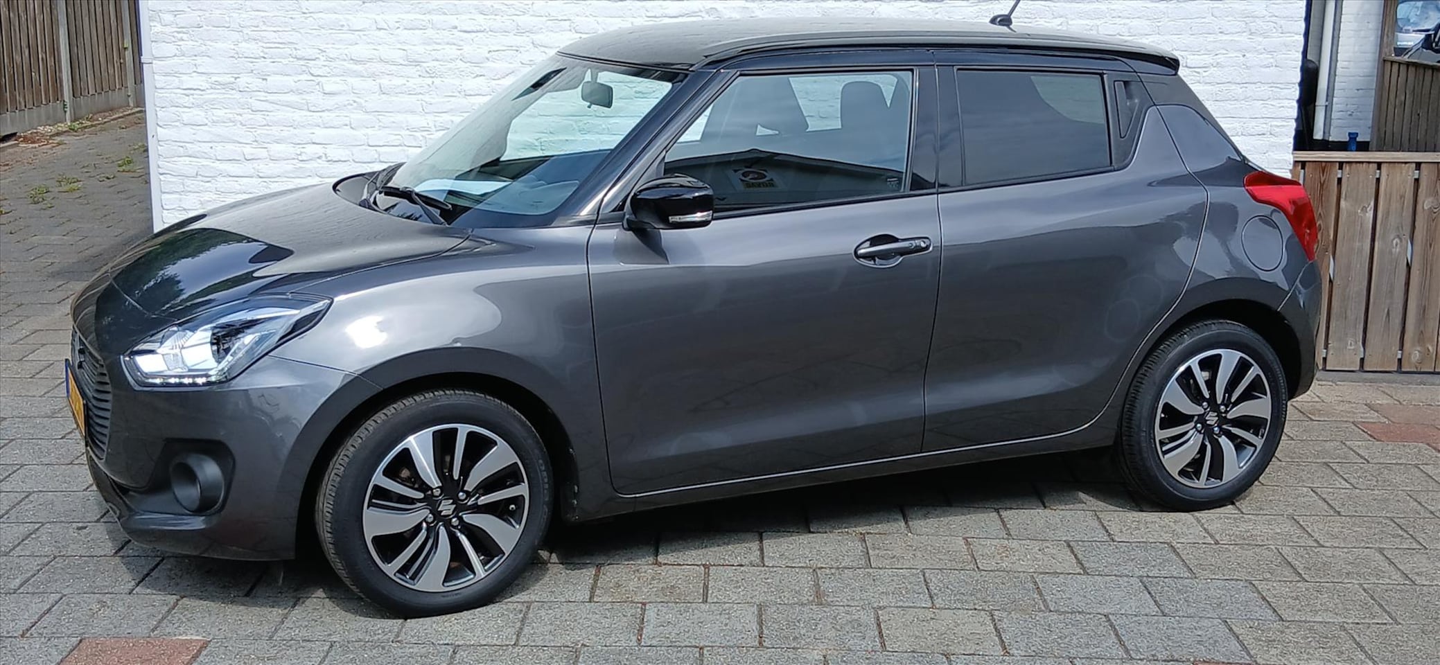 Suzuki Swift - 1.2 5drs stijl clima/app cruise/camera smart hybrid - AutoWereld.nl