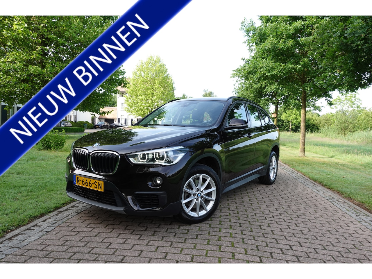 BMW X1 - sDrive18i | Lage KM! | CarPlay | Leder | Camera | Elektrische Klep | - AutoWereld.nl