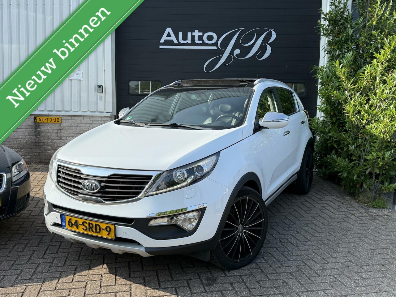 Kia Sportage - 2.0 X-ECUTIVE AUTOMAAT | LEER | PANO | 20 INCH - AutoWereld.nl
