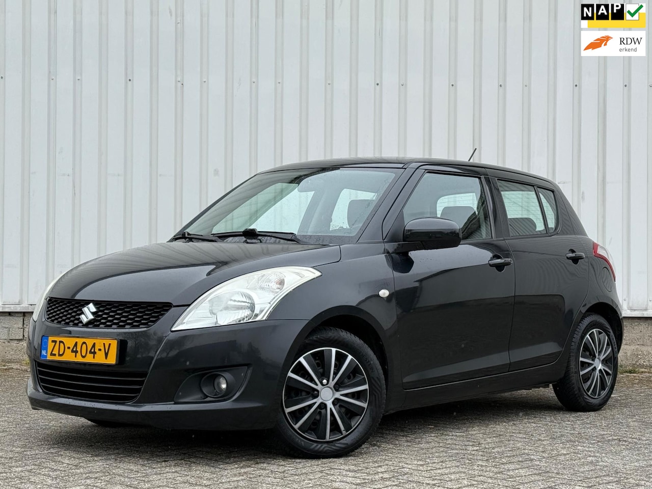 Suzuki Swift - 1.2 Exclusive Stoeverwarming,Airco,CruiseControl,KeylessGo,Spiegelverwarming,DealerOnderho - AutoWereld.nl