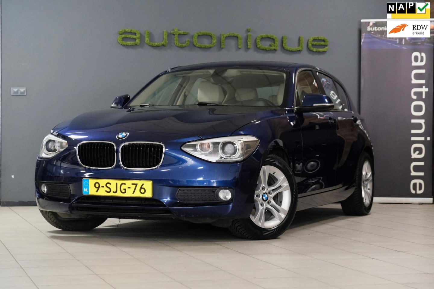 BMW 1-serie - 114i EDE High Executive *Leder/Navigatie/Xenon/Stoelverwarming* 180dkm! - AutoWereld.nl