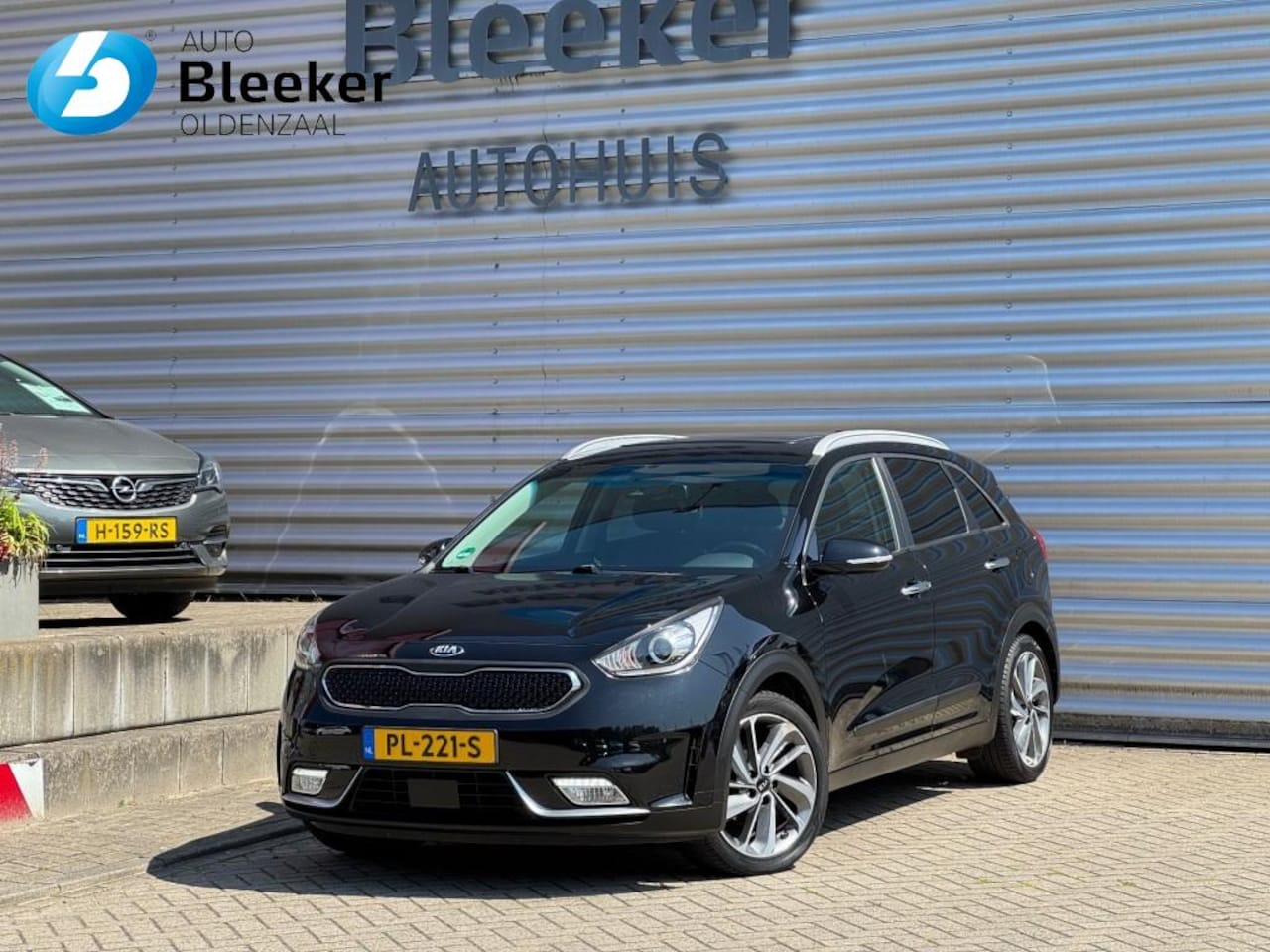 Kia Niro - 1.6 GDI H. Execut.L Airco Leder Trekhaak Carplay Navi Adap Cruise - AutoWereld.nl