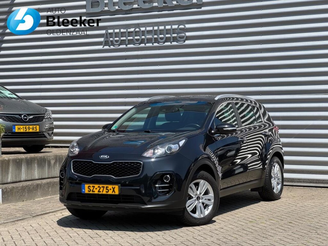 Kia Sportage - 1.6 GDI Design Edition 136Pk Trekhaak Camera Navi - AutoWereld.nl
