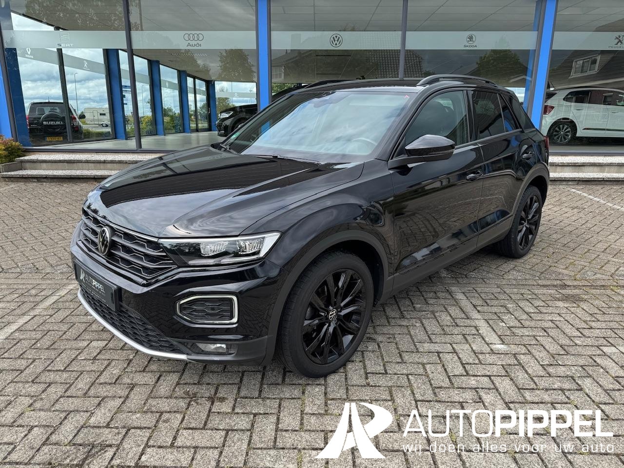 Volkswagen T-Roc - 1.5 TSI Sport | Led | Navi | Black Style | 1e eig. - AutoWereld.nl