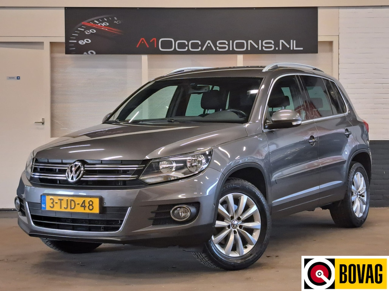 Volkswagen Tiguan - 1.4 TSI Sport&Style + NAVI - AutoWereld.nl