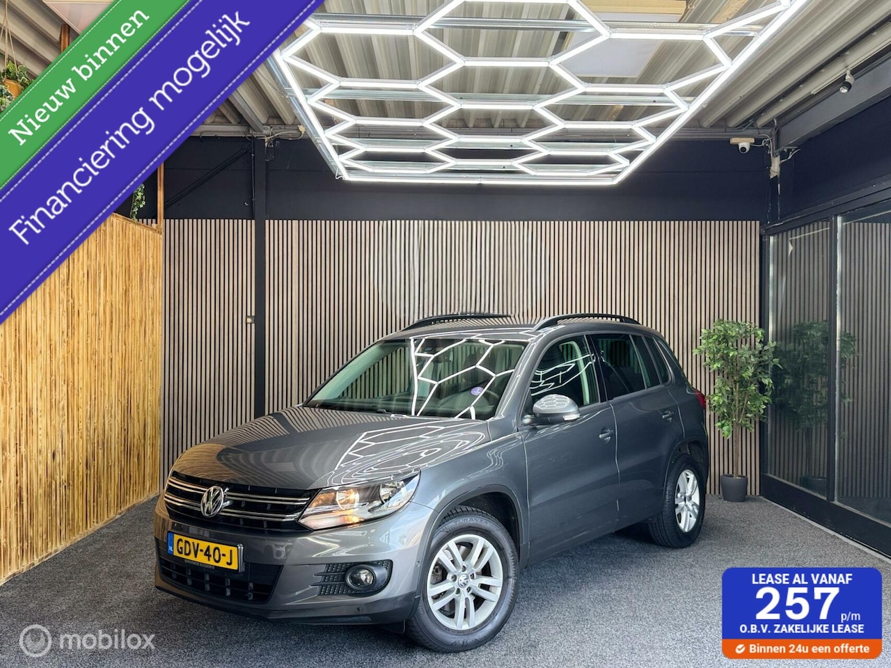 Volkswagen Tiguan - 1.4 TSI Sport&Style | PDC | Camera | Navi - AutoWereld.nl