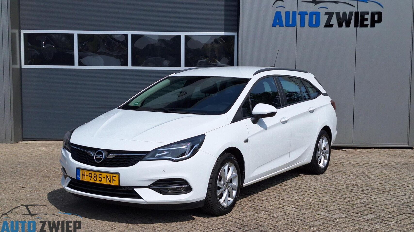 Opel Astra Sports Tourer - 1.2 Edition Clima/Navi/Cruise - AutoWereld.nl