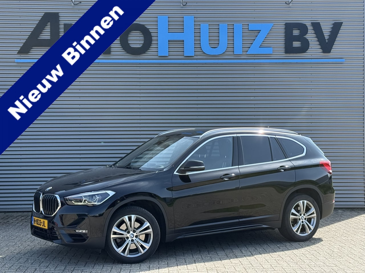 BMW X1 - sDrive20i 192 PK Sport Line Achteruitrijcamera Trekhaak DAB Head-Up Display 18 Inch - AutoWereld.nl