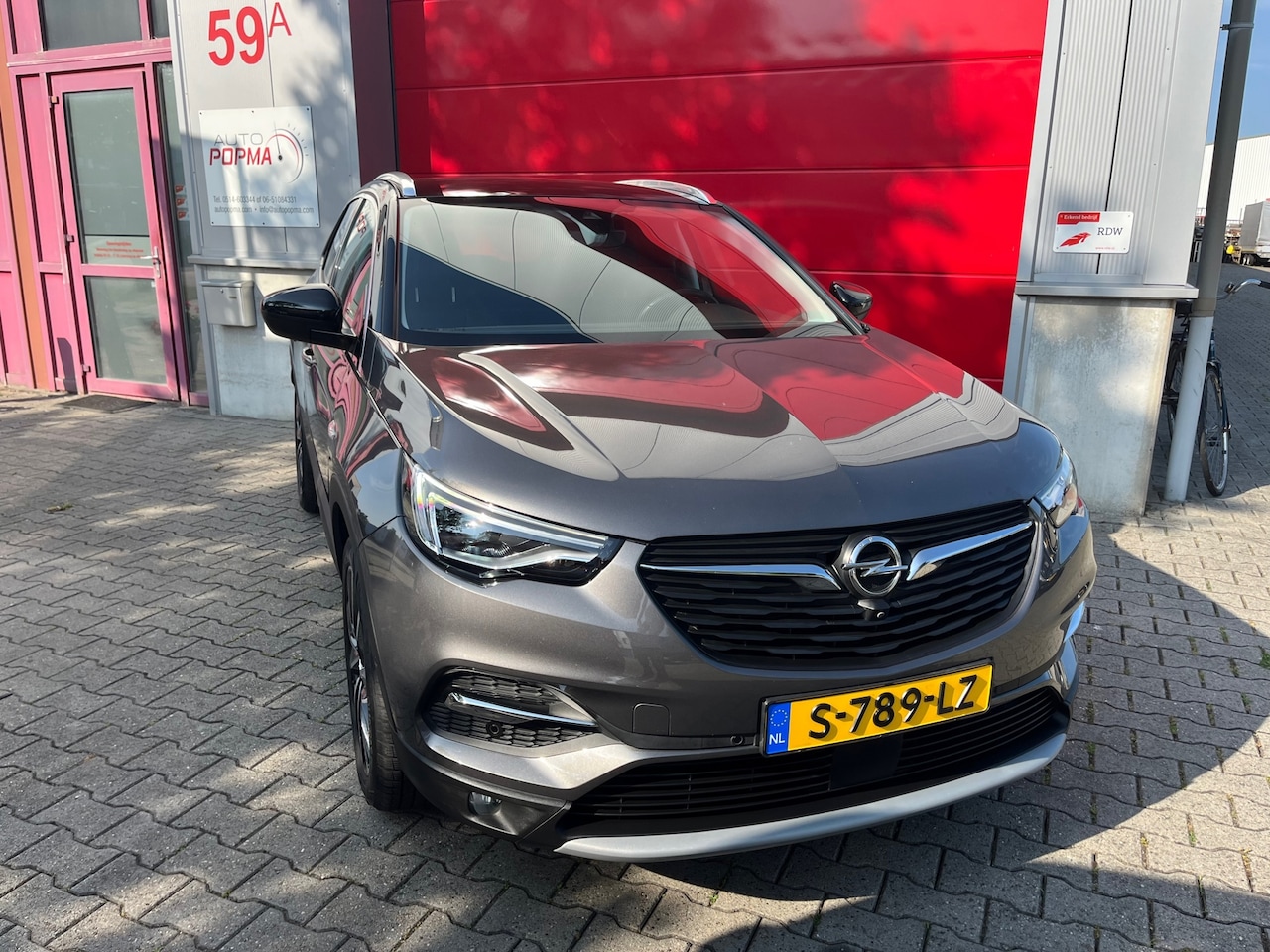 Opel Grandland X - 1.6 Turbo Hybrid 181pk + 41 pk Automaat Business Edition / Trekhaak / Rondom camera / Lede - AutoWereld.nl