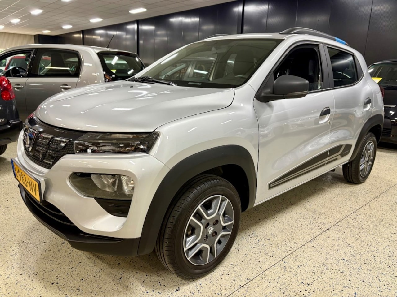 Dacia Spring - BUSINESS / Camera / Cruise / Navi / Dab / Airco / Apple carplay - AutoWereld.nl