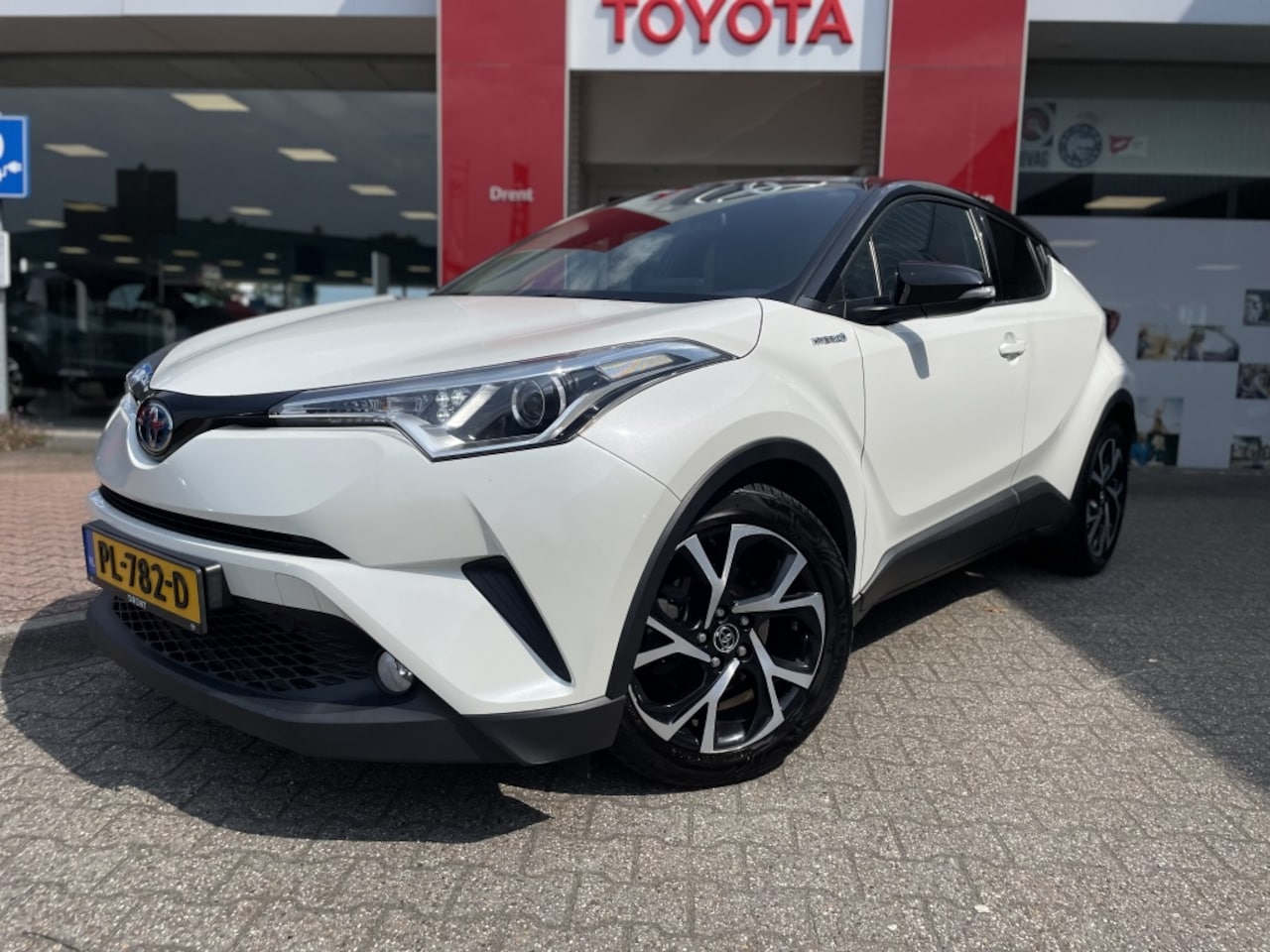 Toyota C-HR - 1.8 Hybrid Bi-Tone | Navi | Stoelverwarming | Cruise Control - AutoWereld.nl