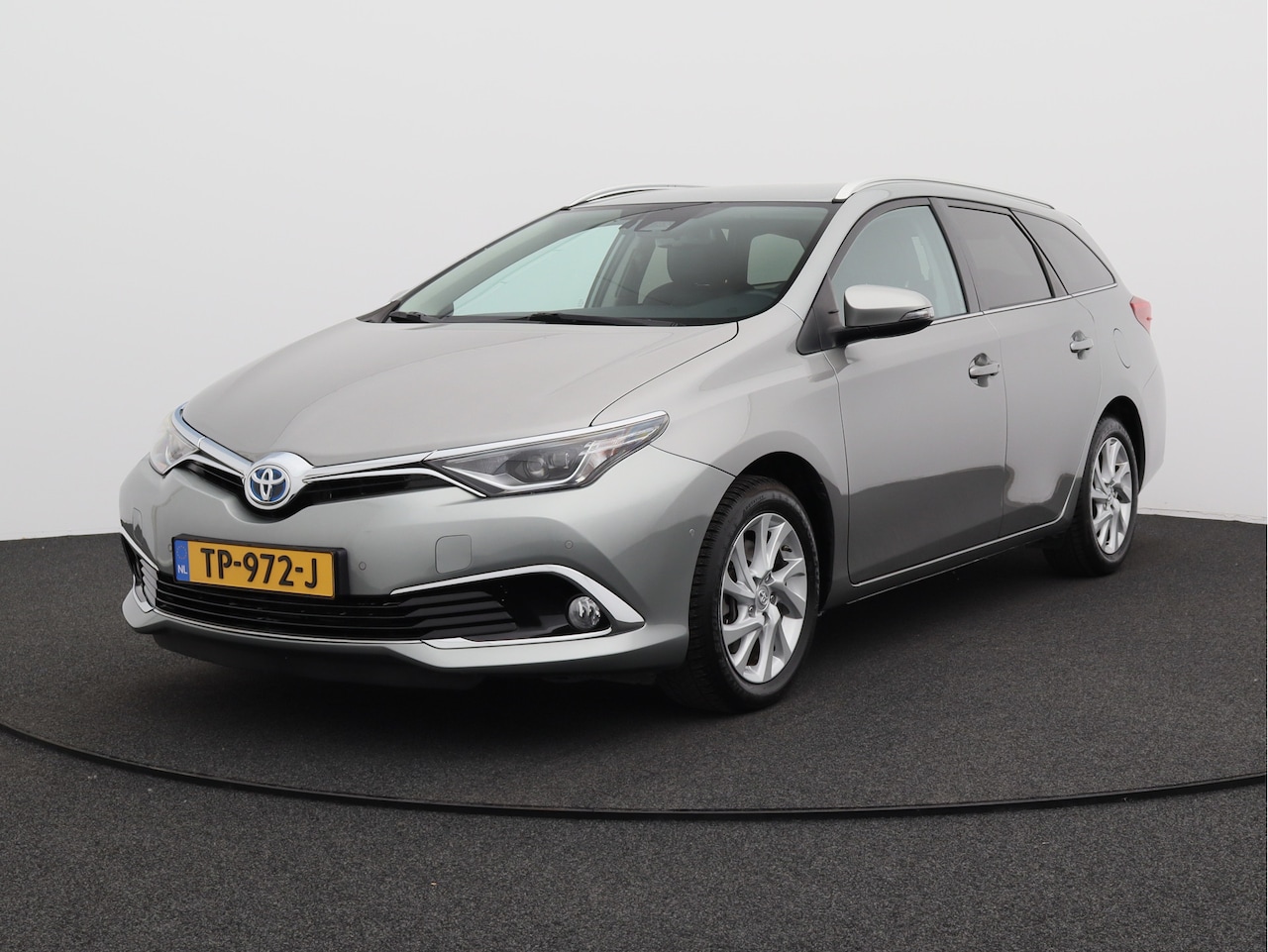Toyota Auris Touring Sports - 1.8 Hybrid Executive/ lage km/ zeer mooi! - AutoWereld.nl
