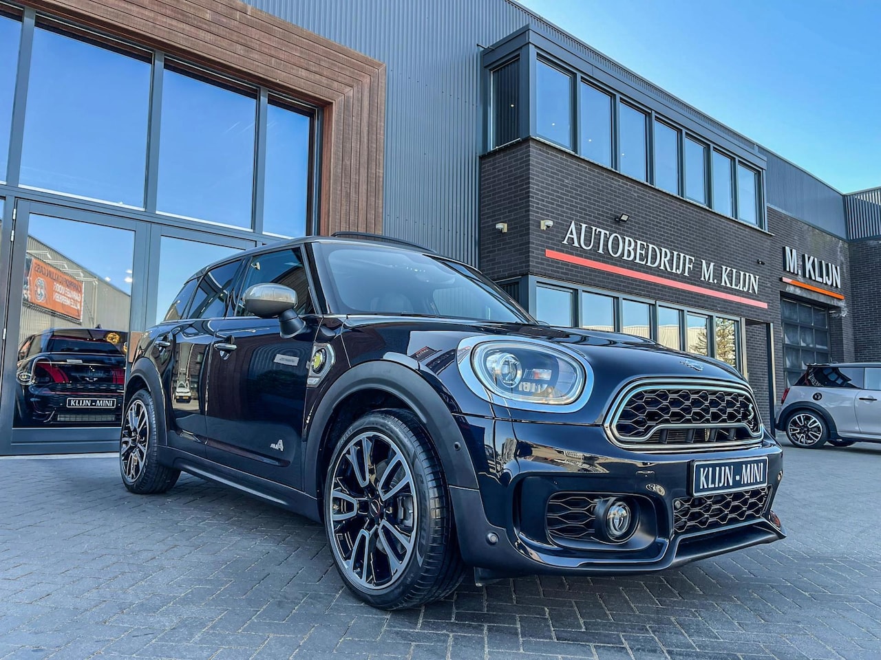 MINI Countryman - Mini 2.0 Cooper S E ALL4 John Cooper Works aut 224pk/pano/lounge/bomvol - AutoWereld.nl