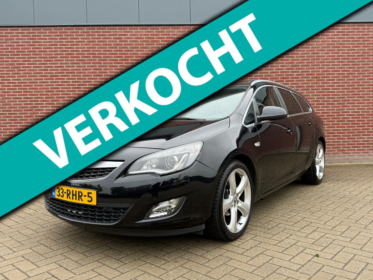 Opel Astra Sports Tourer - 1.4 Turbo Sport / NAP / Cruise / Airco / PDC / Trekhaak - AutoWereld.nl