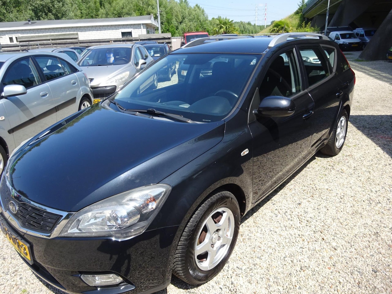 Kia Cee'd Sporty Wagon - 1.4 CVVT X-ecutive airco cruise control trekhaak - AutoWereld.nl