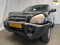 Hyundai Tucson - 2.0i 4WD Style - Airco - Front Schade