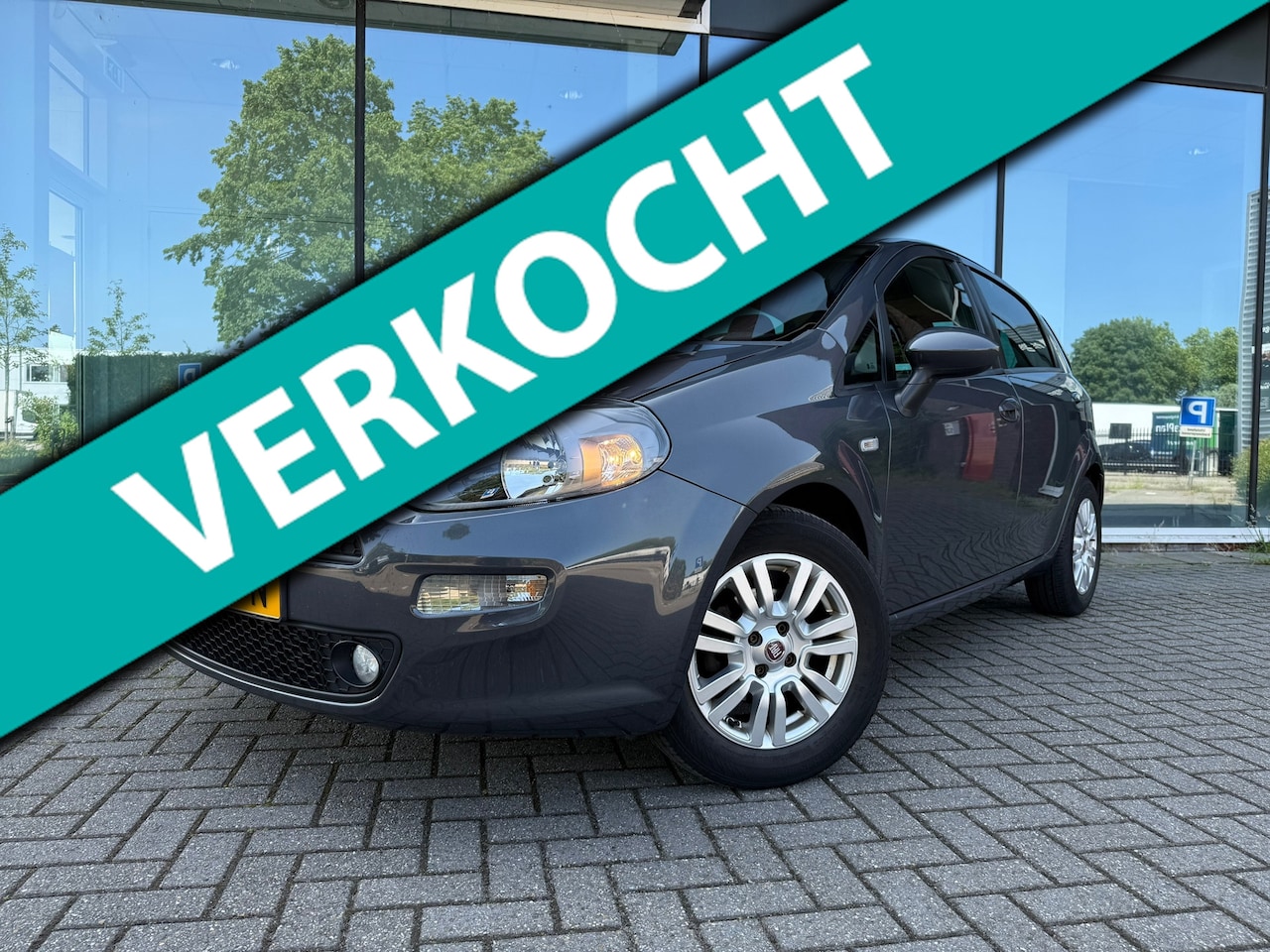 Fiat Punto Evo - 0.9 TwinAir Lounge - Climate - Media - Trekhaak - Parkeerhulp - AutoWereld.nl