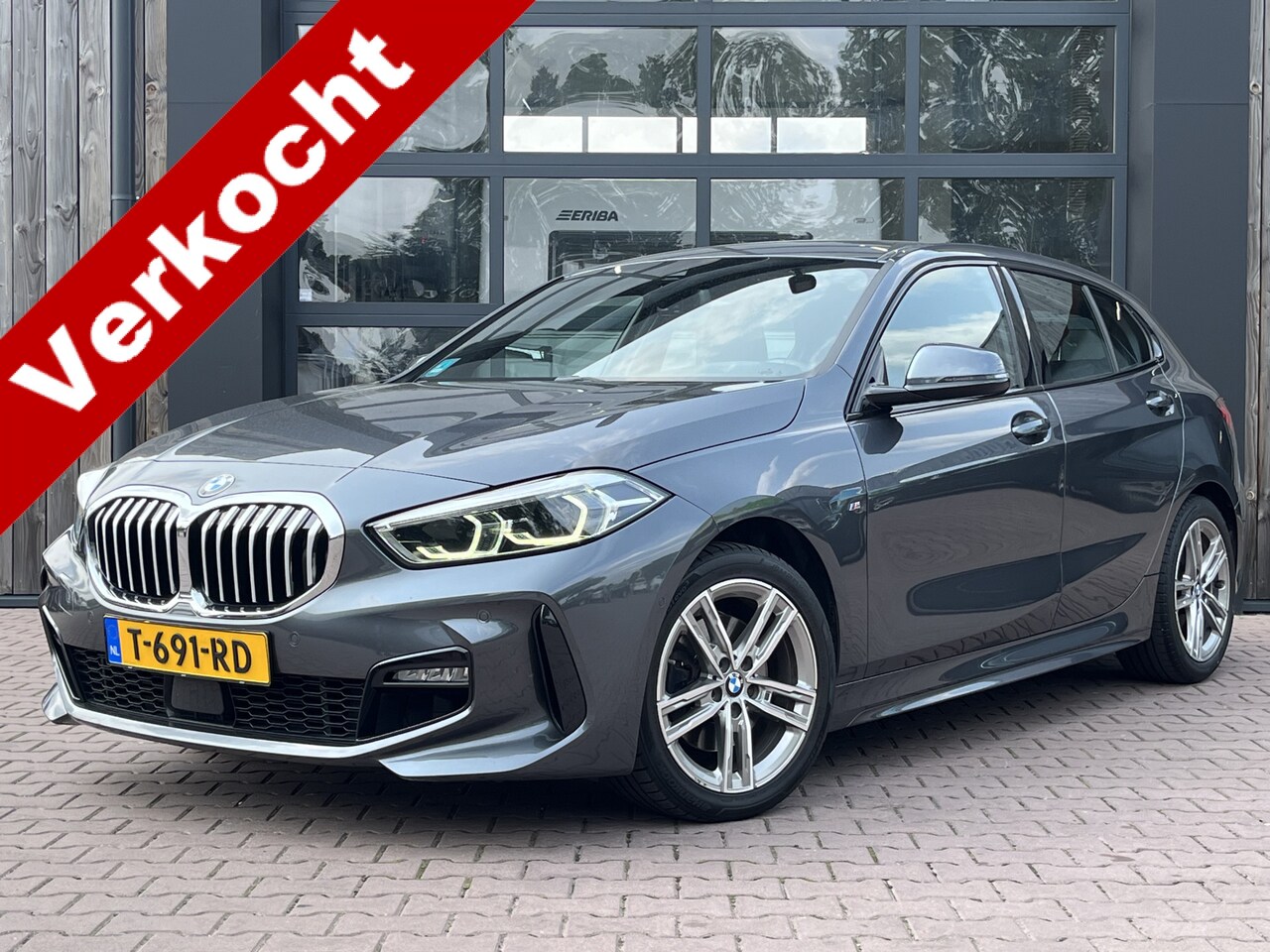 BMW 1-serie - 118i High Executive | M-Sport | Trekhaak | Stoelverwarming | Keyless | Carplay | Camera | - AutoWereld.nl
